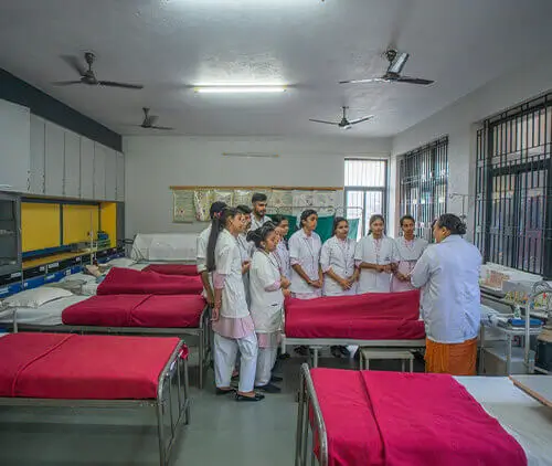Campus of a top nursing college in Bangalore with modern facilities and students engaged in clinical practice.